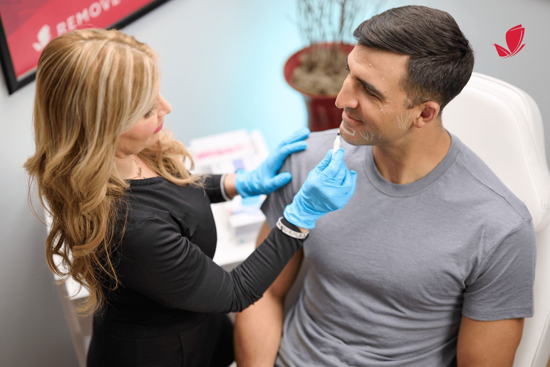 blond woman helping figure out botox injections for male client.