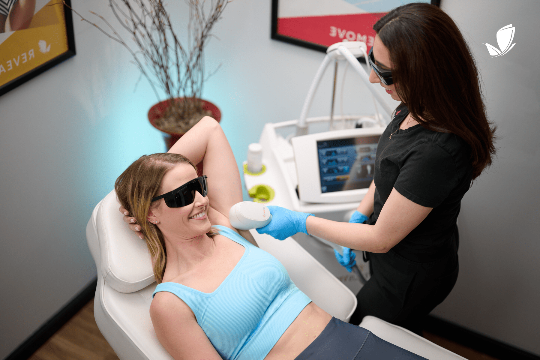 woman receiving laser hair removal in her under arm area.